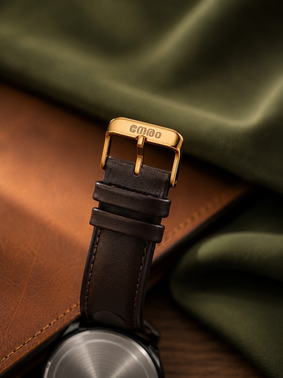 Gold-tone Neram buckle on espresso brown leather